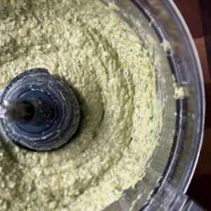 Avocado Pesto blended in the bowl of a food processor