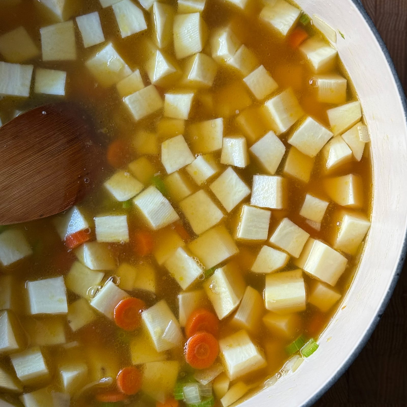 Seafood Stock Covering Sweet Potatoes for Chowder