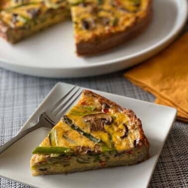 Slice of Hashbrown Crusted Asparagus Mushroom Quiche