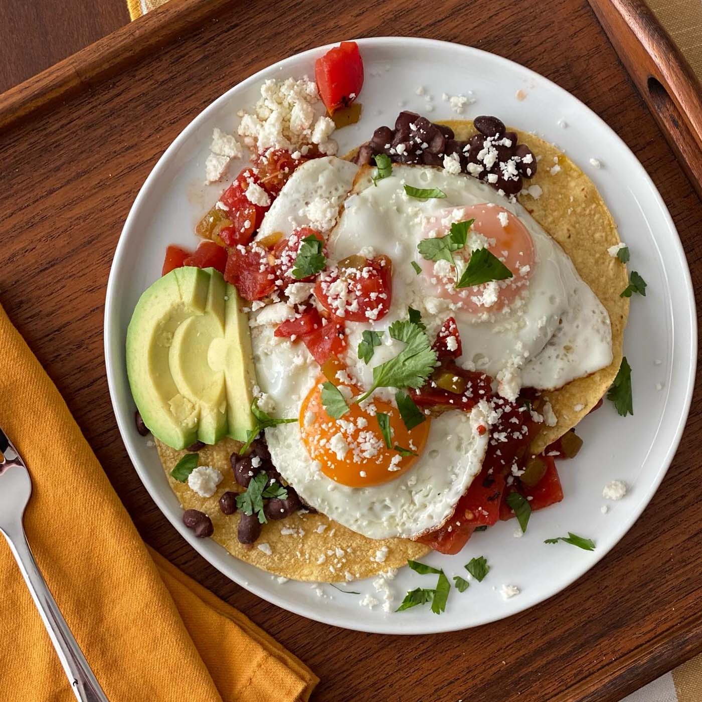 Plated Huevos Rancheros Topped with Eggs