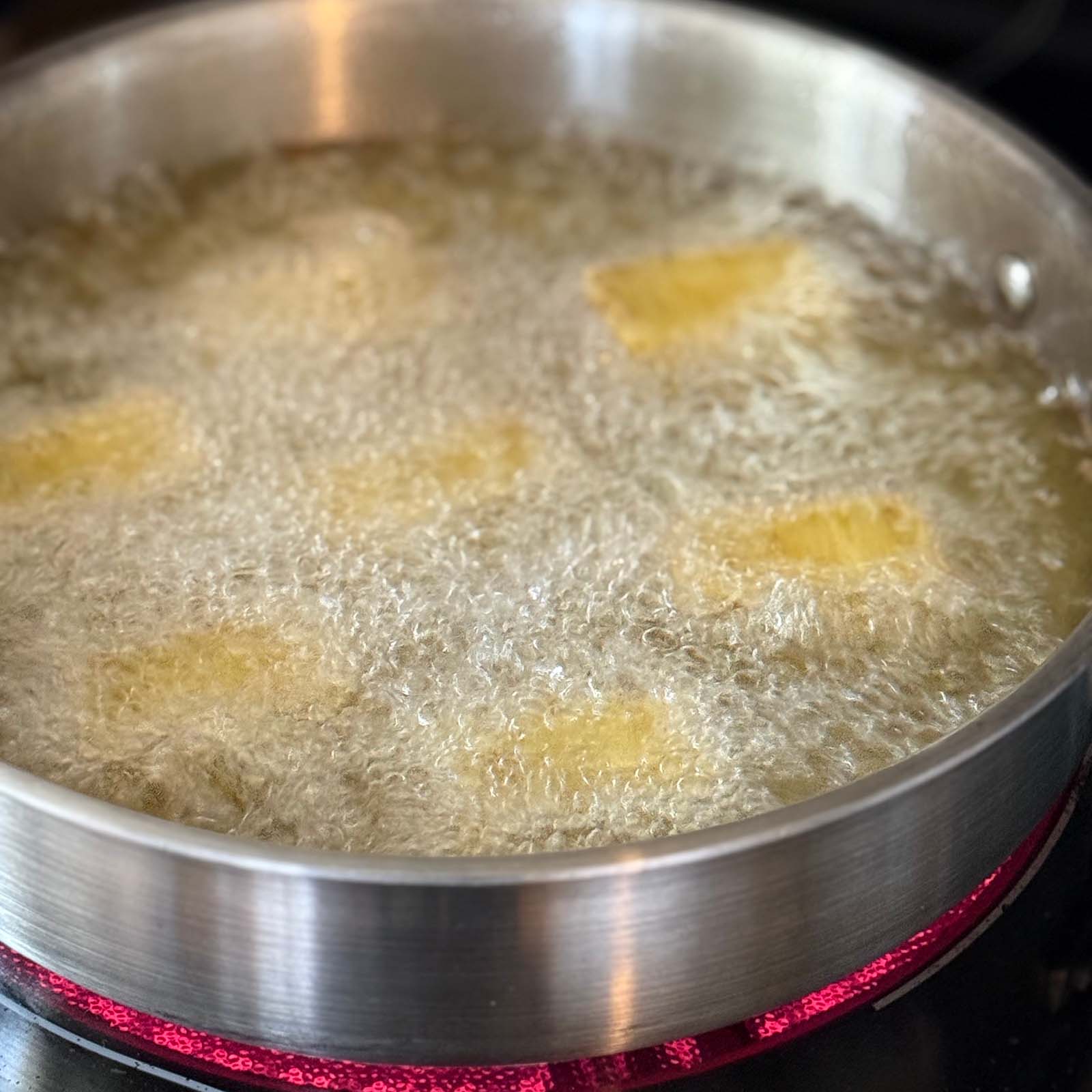 Potato Pave Frying in Skillet with Oil