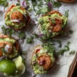 Sweet Potato Bites with Shrimp & Avocado on a baking sheet