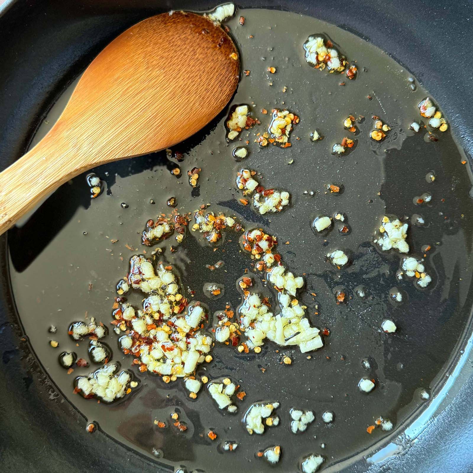 Garlic & Red Pepper Flakes in Olive Oil in Skillet