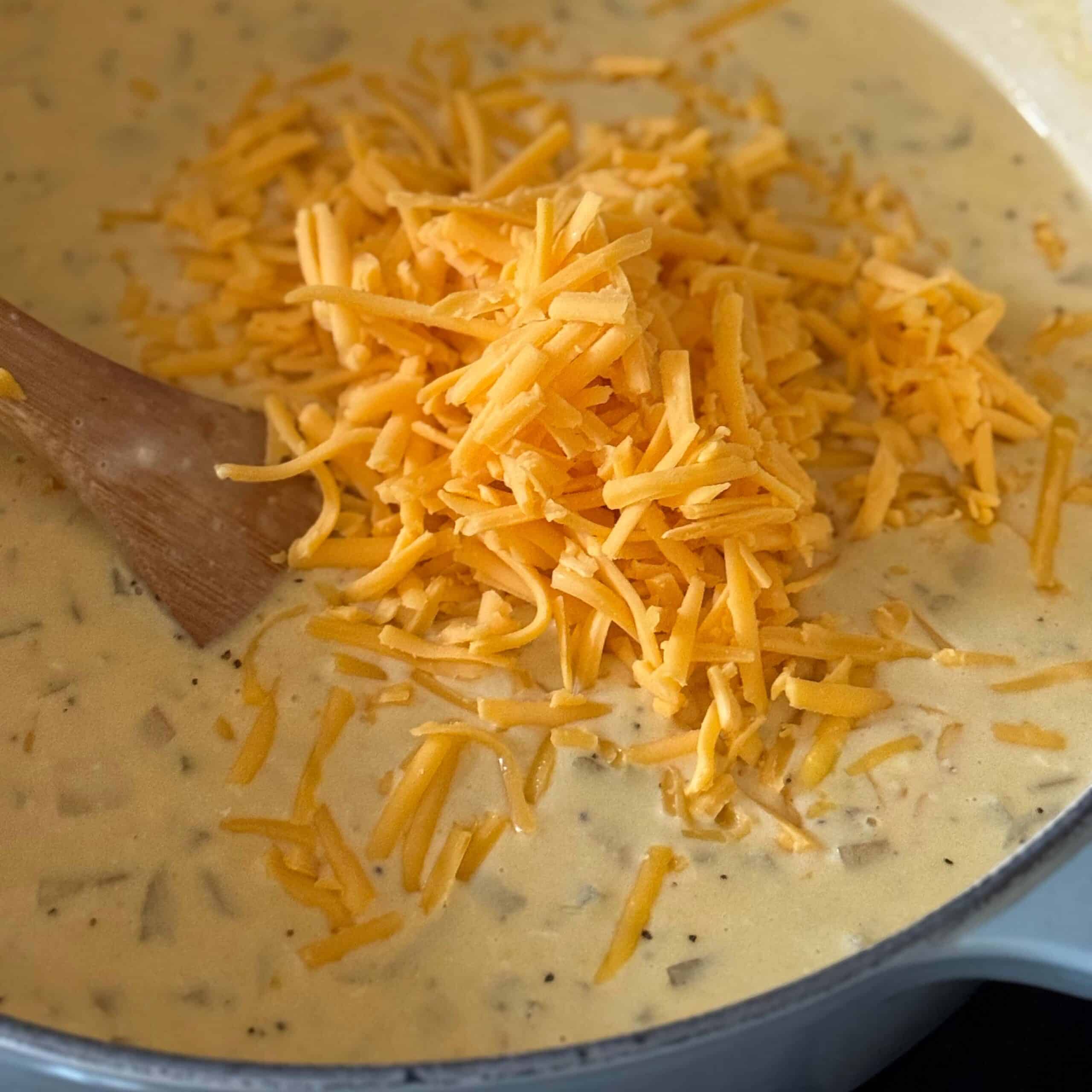 3 Shredded Cheese added to Cheesy Potato Soup
