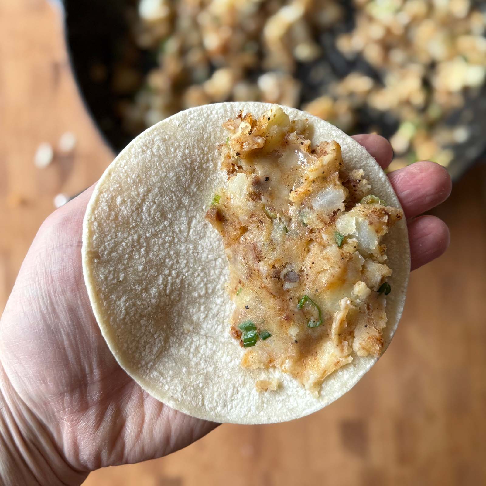 Potato Taco filling on half of the tortilla