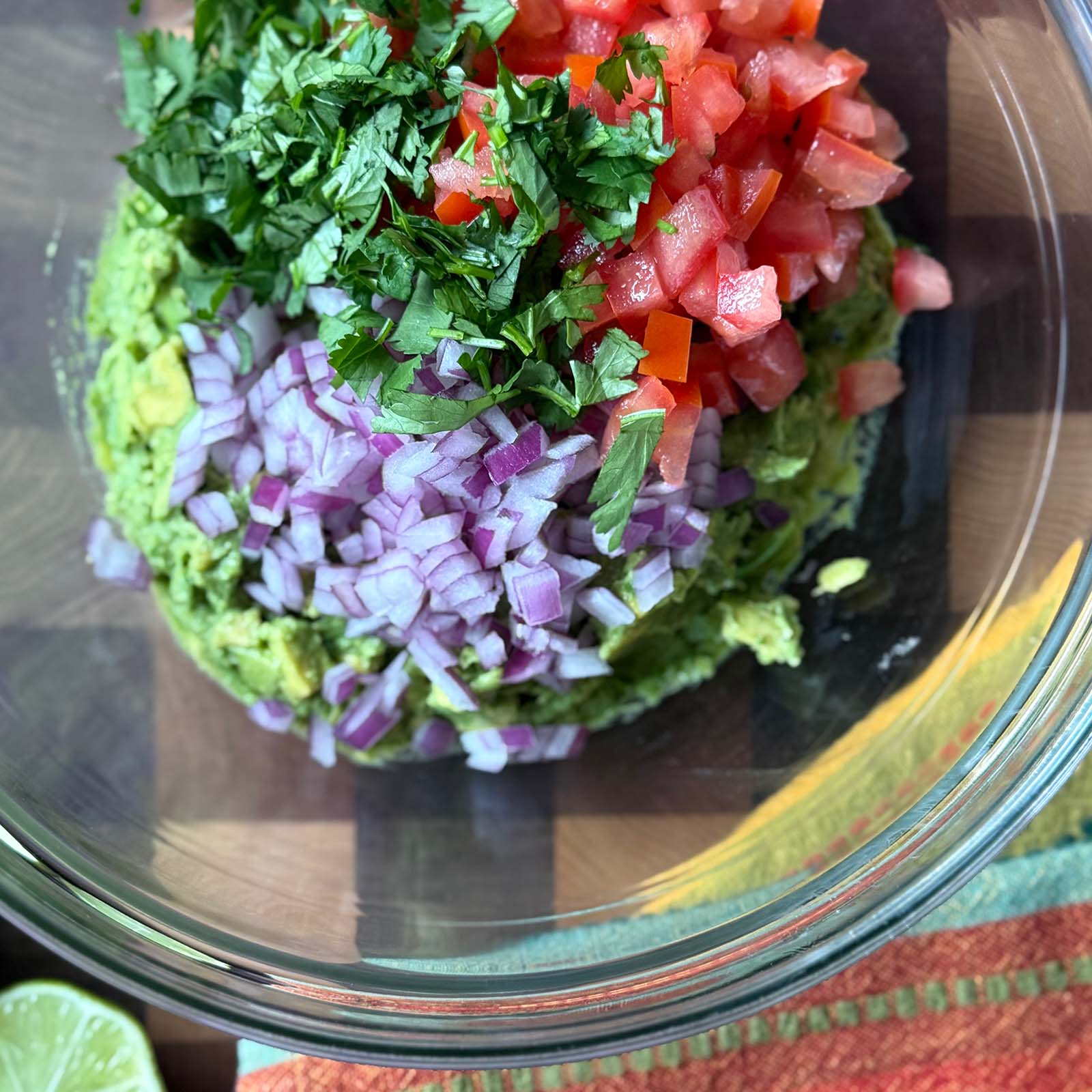 Tomato Onion and Cilantro in Bowl with Smashed Avocado