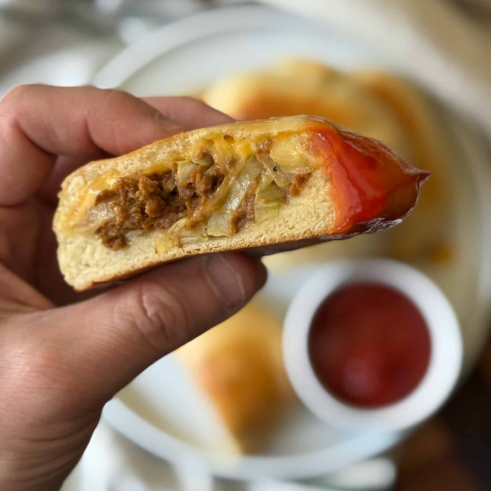 Vegetarian Runza Dipped in Ketchup