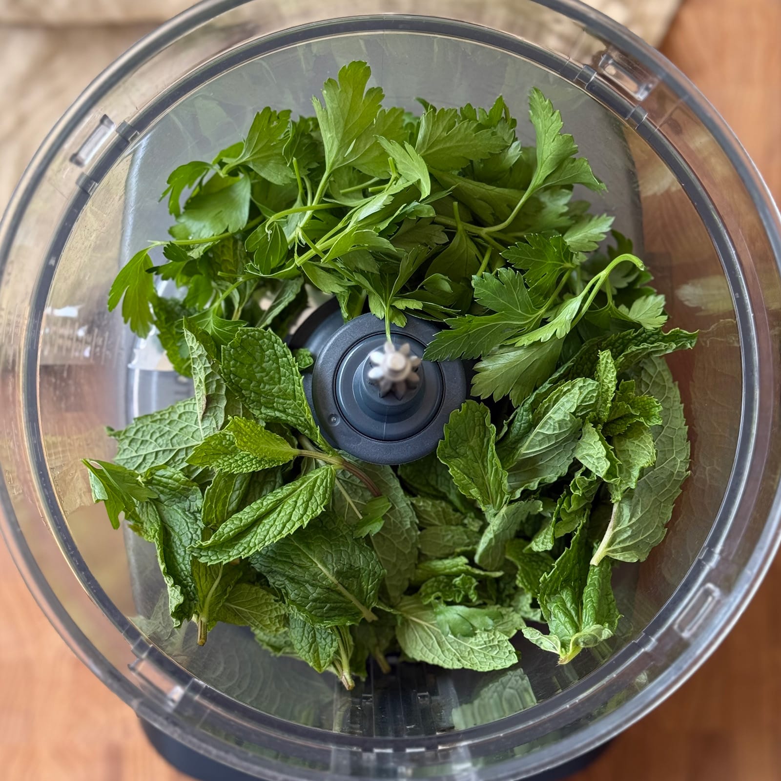 Mint and Parsley Leaves in a Food Processor
