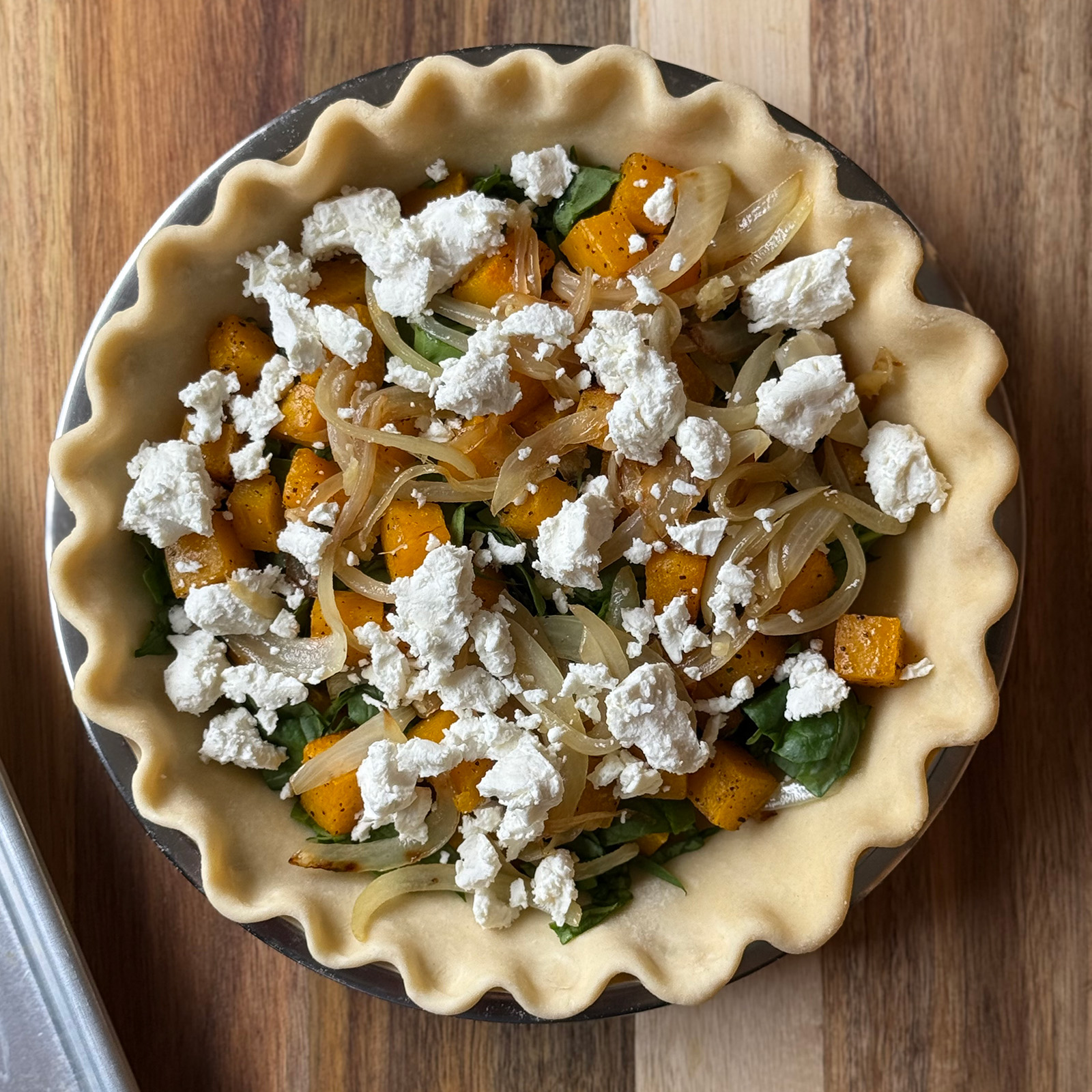 Ingredients Layered into Pie Shell for Butternut Squash Quiche