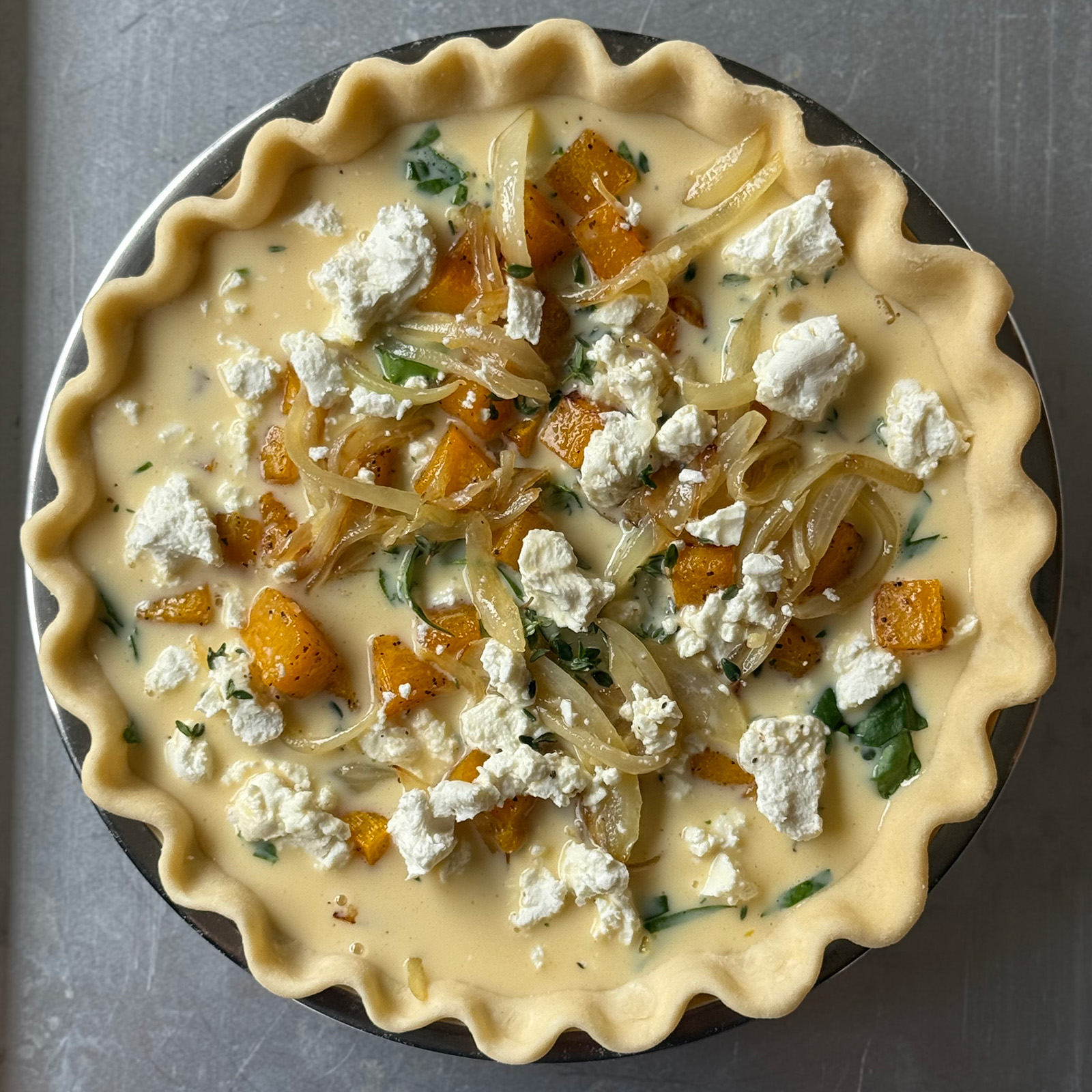 Unbaked Butternut Squash Quiche Ready for the Oven