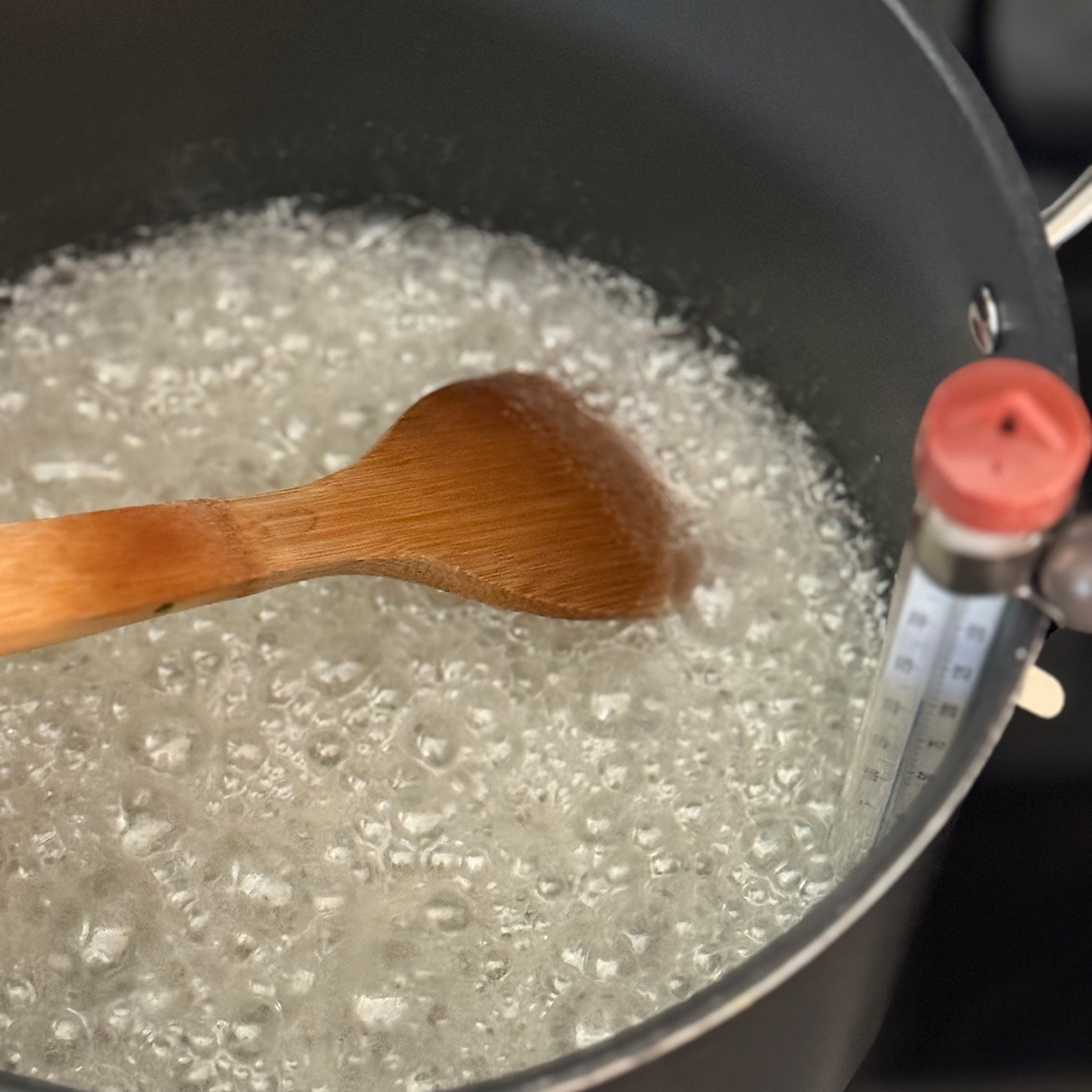 Candy Thermometer in Pan with Syrup at Soft Ball Stage