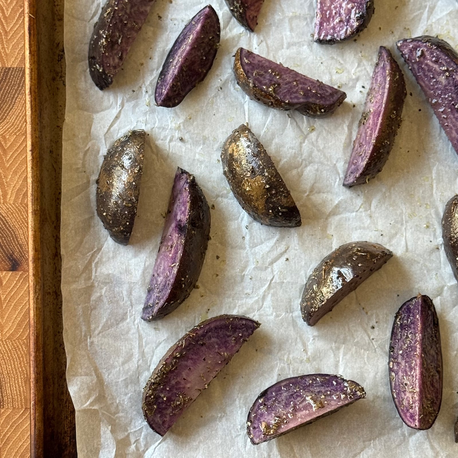 Seasoned Purple Potato Wedges on a Sheetpan
